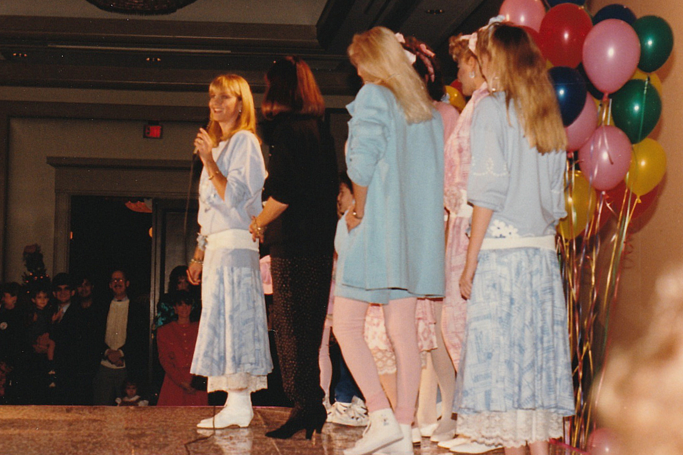 Olivia Newton-John hosting a fashion show of "Koala Blue" designs at a charity benefit at the Stouffer Hotel (now the Renaissance Hotel Austin) in Austin, Texas, United States.