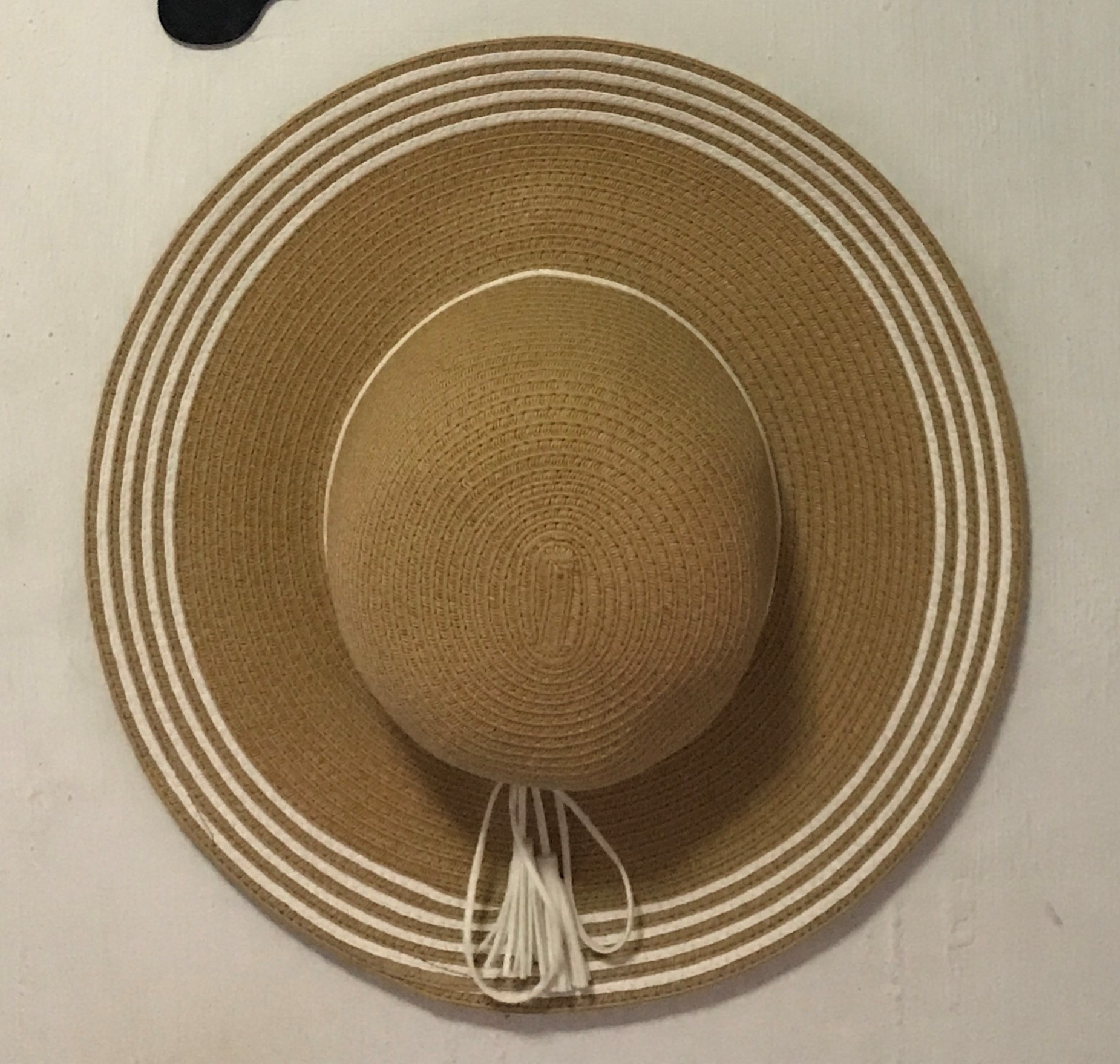 Sun Hat hanged on a wall
